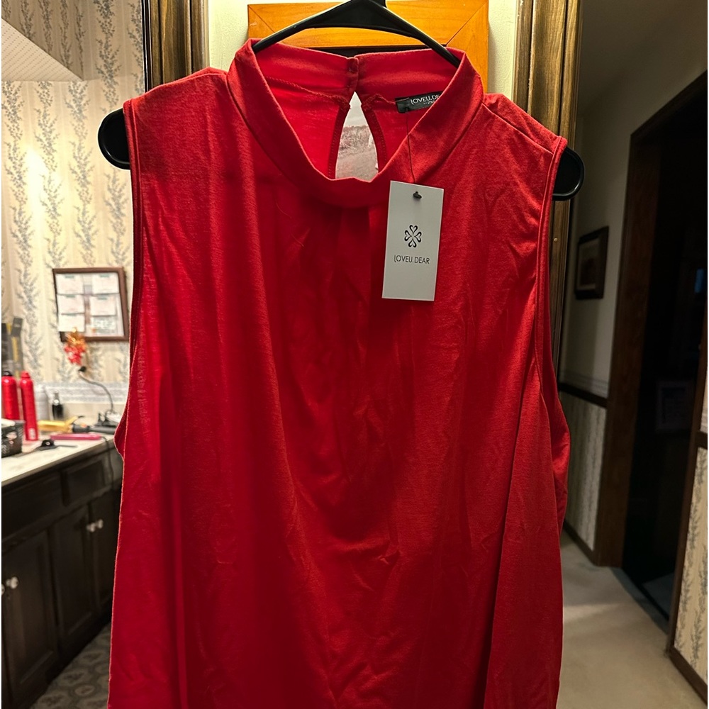 Cute, bright red sleeveless mock tee! Perfect under cardi!